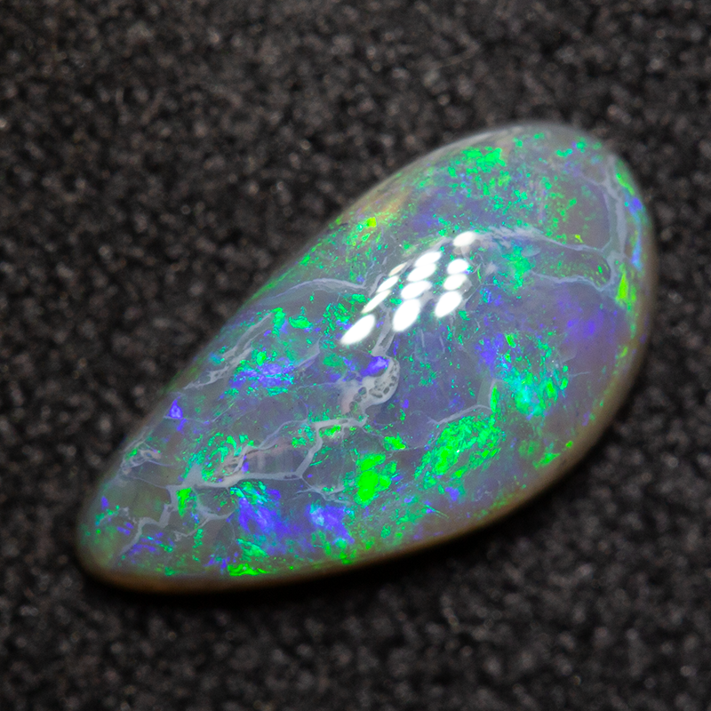 0.82 ct black opal 9.8x5.1x2.7mm