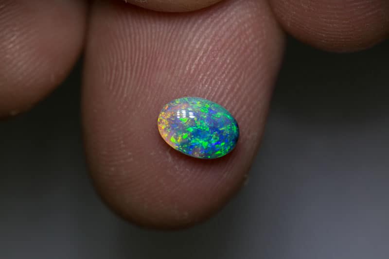0.82 ct dark opal 8x5.5x3mm