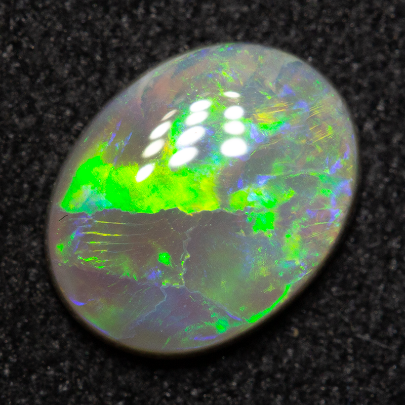 0.83 ct dark opal 8.2x6.4x2.3mm