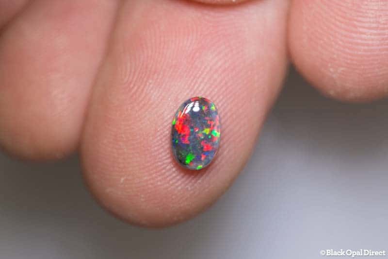 0.83 ct black opal gem 7.5x5x3mm