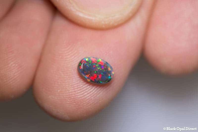 0.83 ct black opal gem 7.5x5x3mm