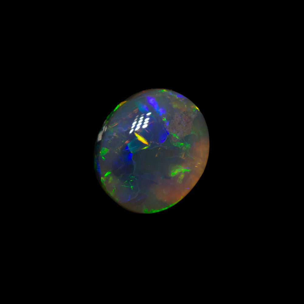0.84 ct dark crystal opal 6.9x5.9x3.4mm