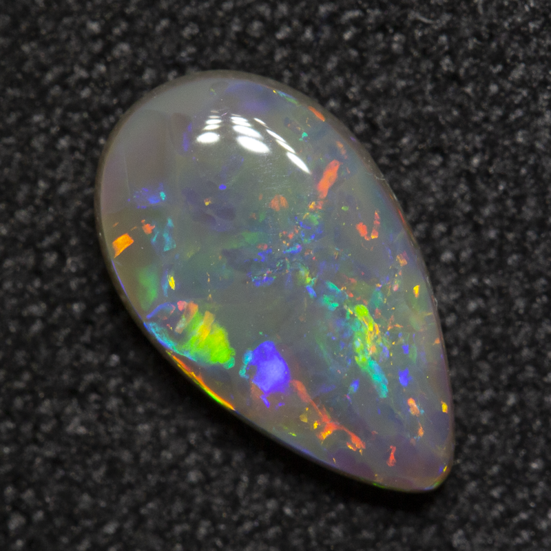 0.84 ct dark opal 9.4x5.5x2.5mm
