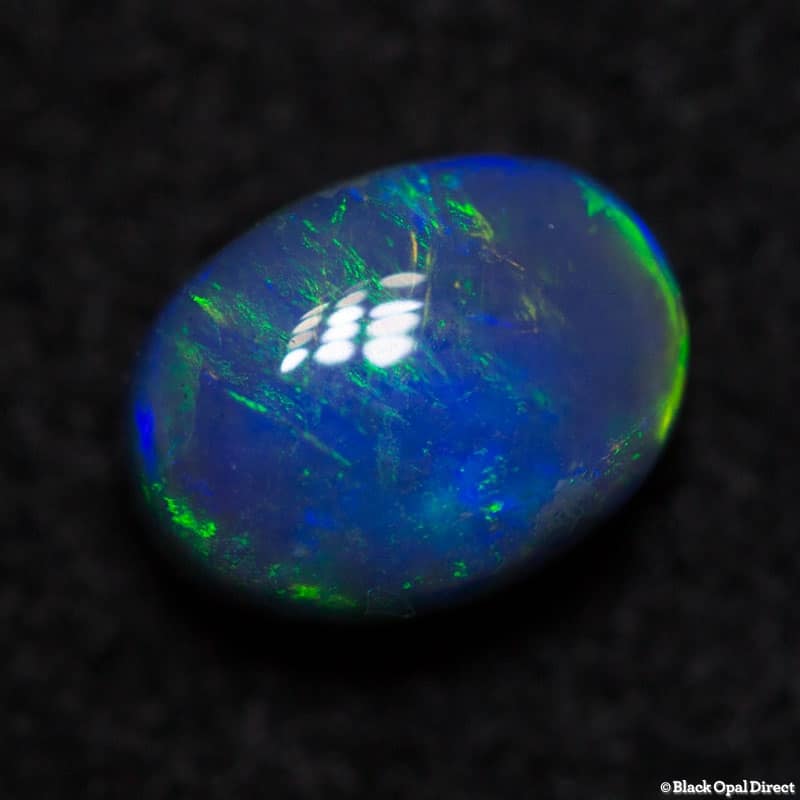 0.84 ct black opal 6.3x4.9x4mm