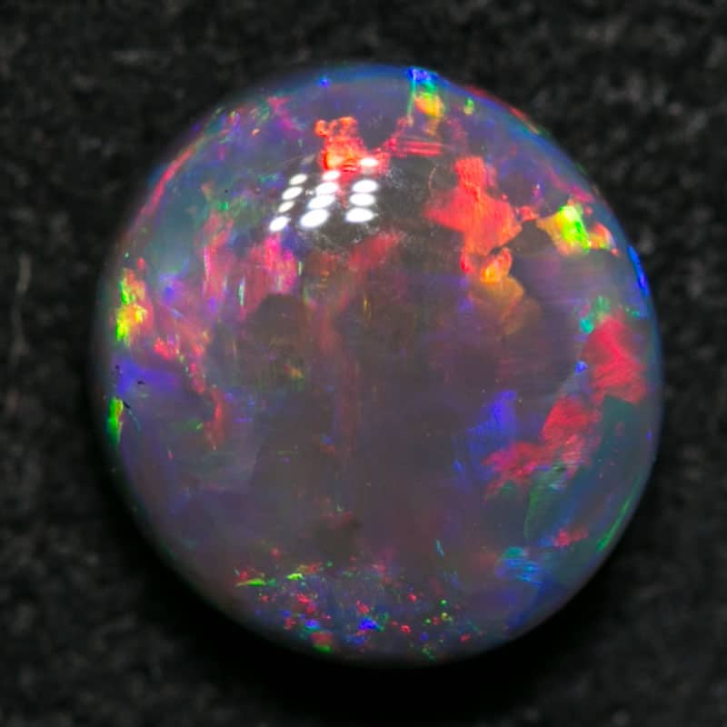 0.84 ct black opal gem 6.3x6x3mm