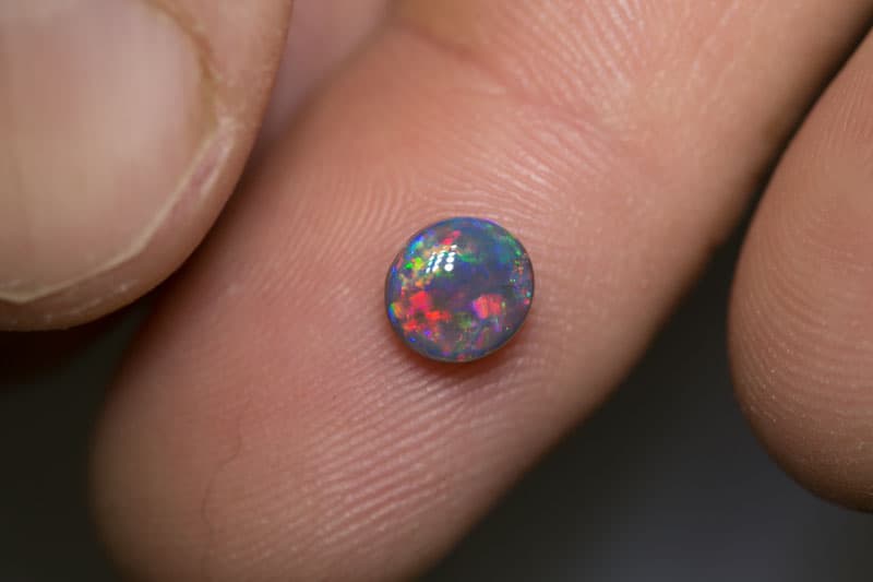 0.84 ct black opal gem 6.3x6x3mm