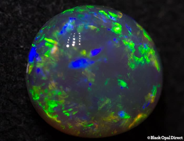 0.84 ct gem green dark crystal opal 7x6x3.5mm