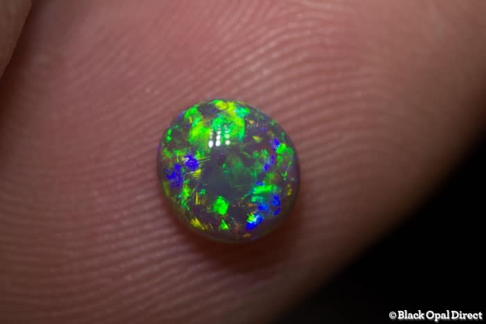 0.84 ct gem green dark crystal opal 7x6x3.5mm