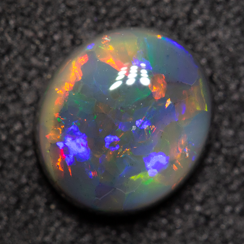 0.85 ct black opal 6.9x6.1x3mm