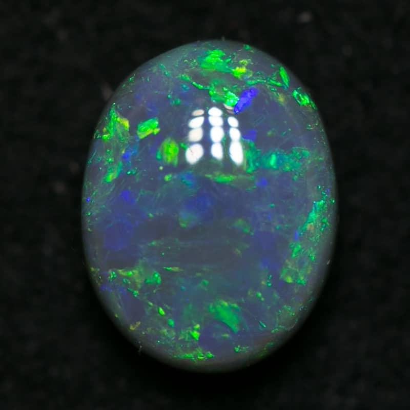 0.85 ct black opal 6.5x5x3mm