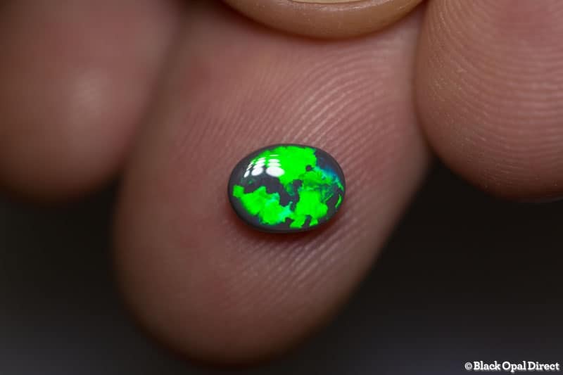 0.86 ct dark opal 7.5x5.5x3mm