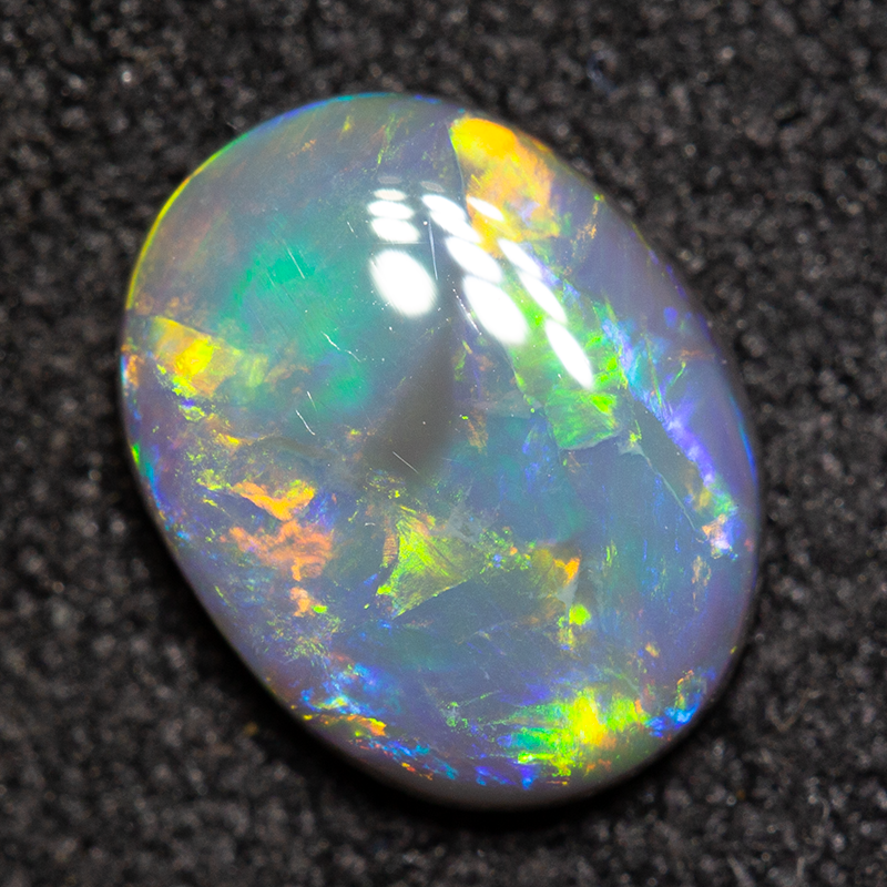 0.87 ct black opal 8.4x6.5x2.4mm