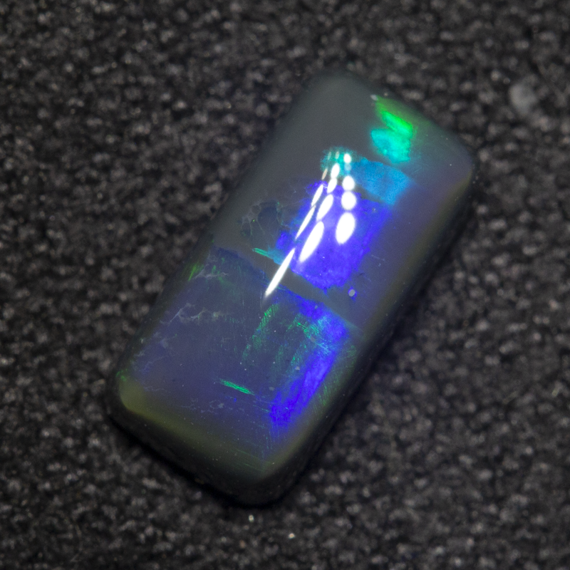 0.88 ct black opal 8.5x4.2x3mm