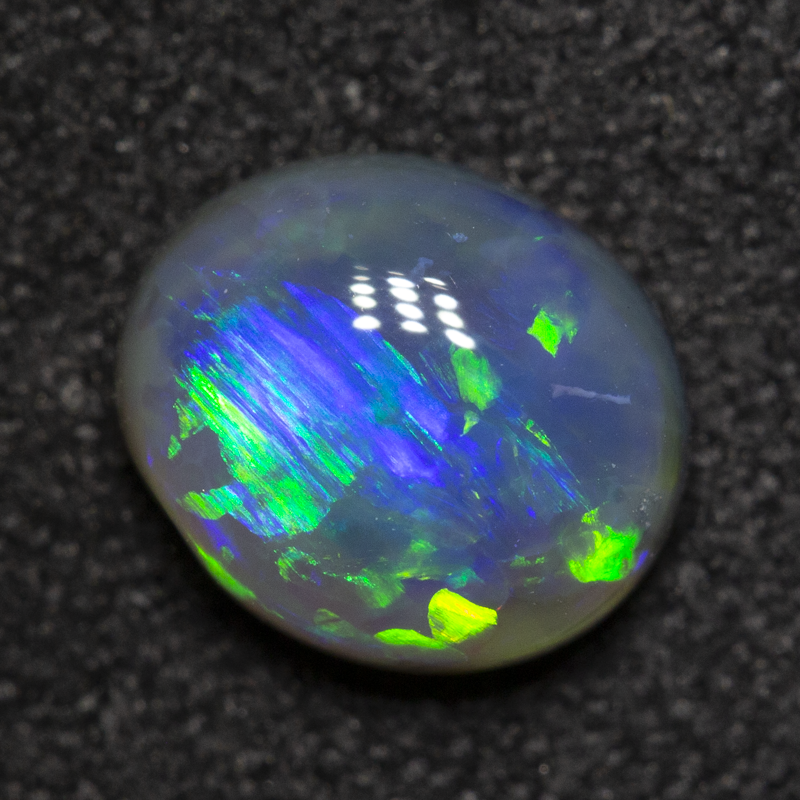 0.88 ct black opal 7x6.1x3.2mm