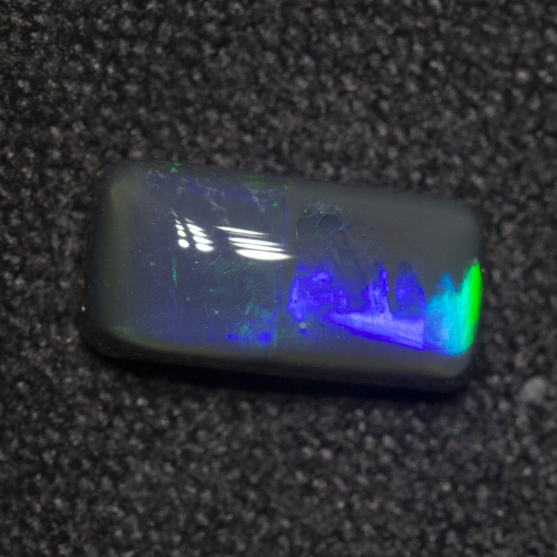 0.88 ct black opal 8.5x4.2x3mm