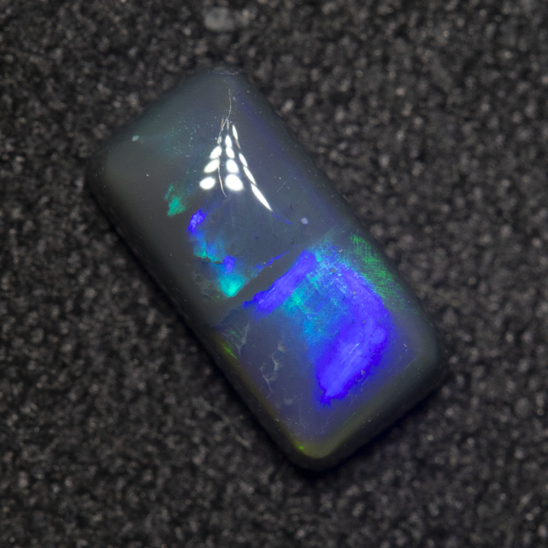 0.88 ct black opal 8.5x4.2x3mm