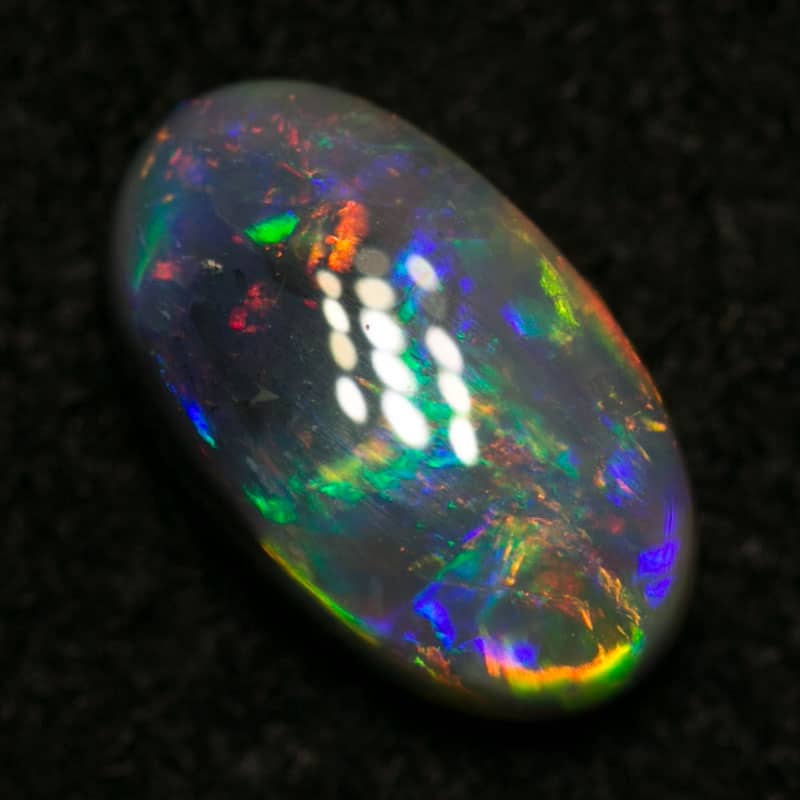 0.88 ct dark opal 8x5x3mm