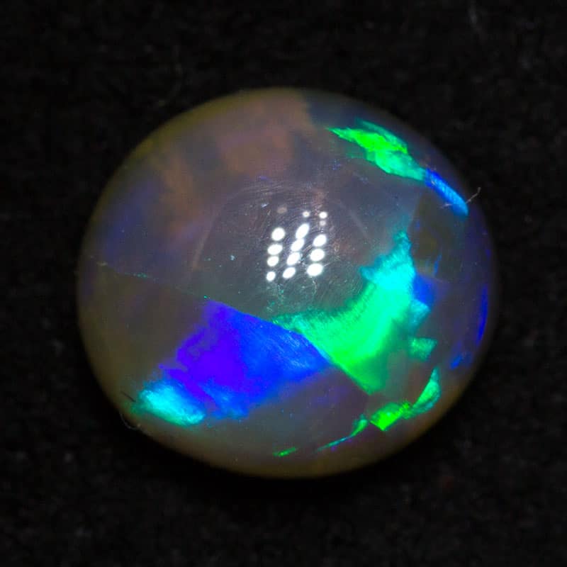 0.90 ct crystal opal with cats eye pattern 6.5x6x3mm