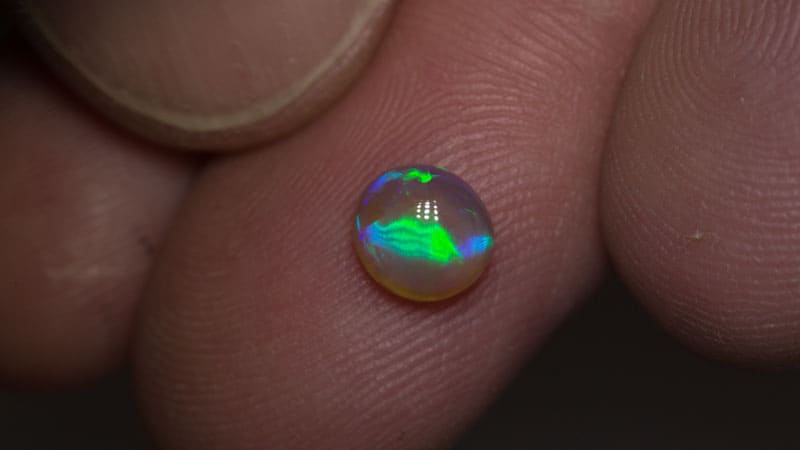 0.90 ct crystal opal with cats eye pattern 6.5x6x3mm