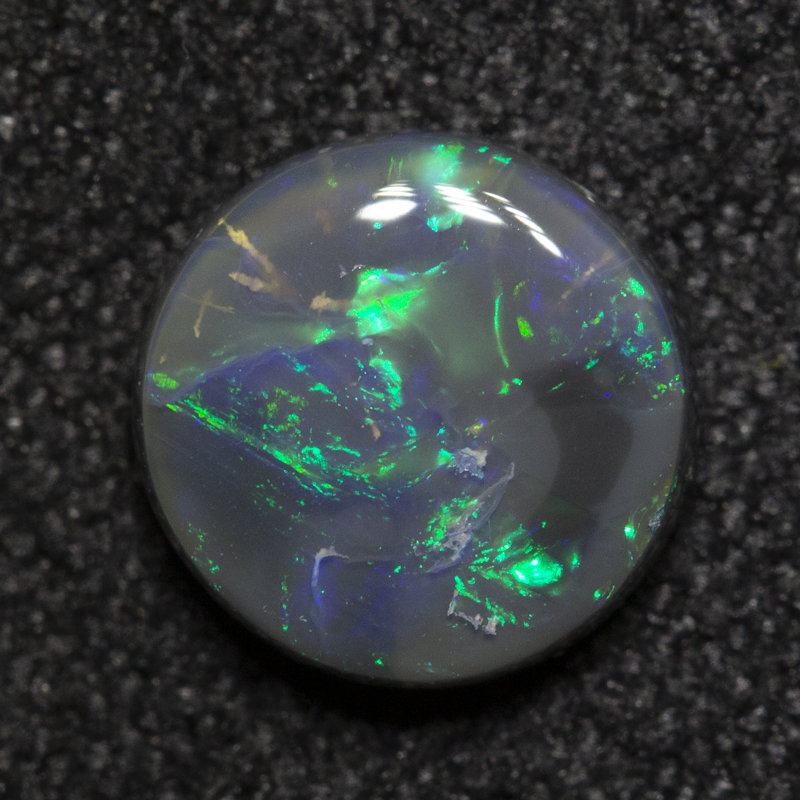 0.92 ct black opal 6.9x6.8x2.6mm