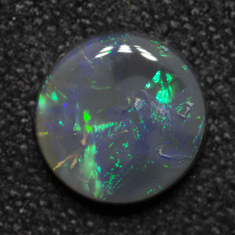 0.92 ct black opal 6.9x6.8x2.6mm