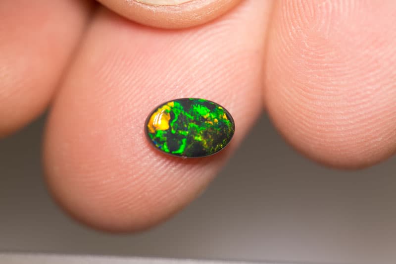 0.92 ct black opal 8.5x6x3mm