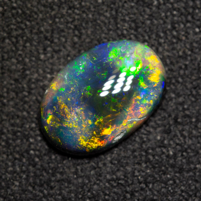 0.94 ct black opal 9x6.2x2.6mm