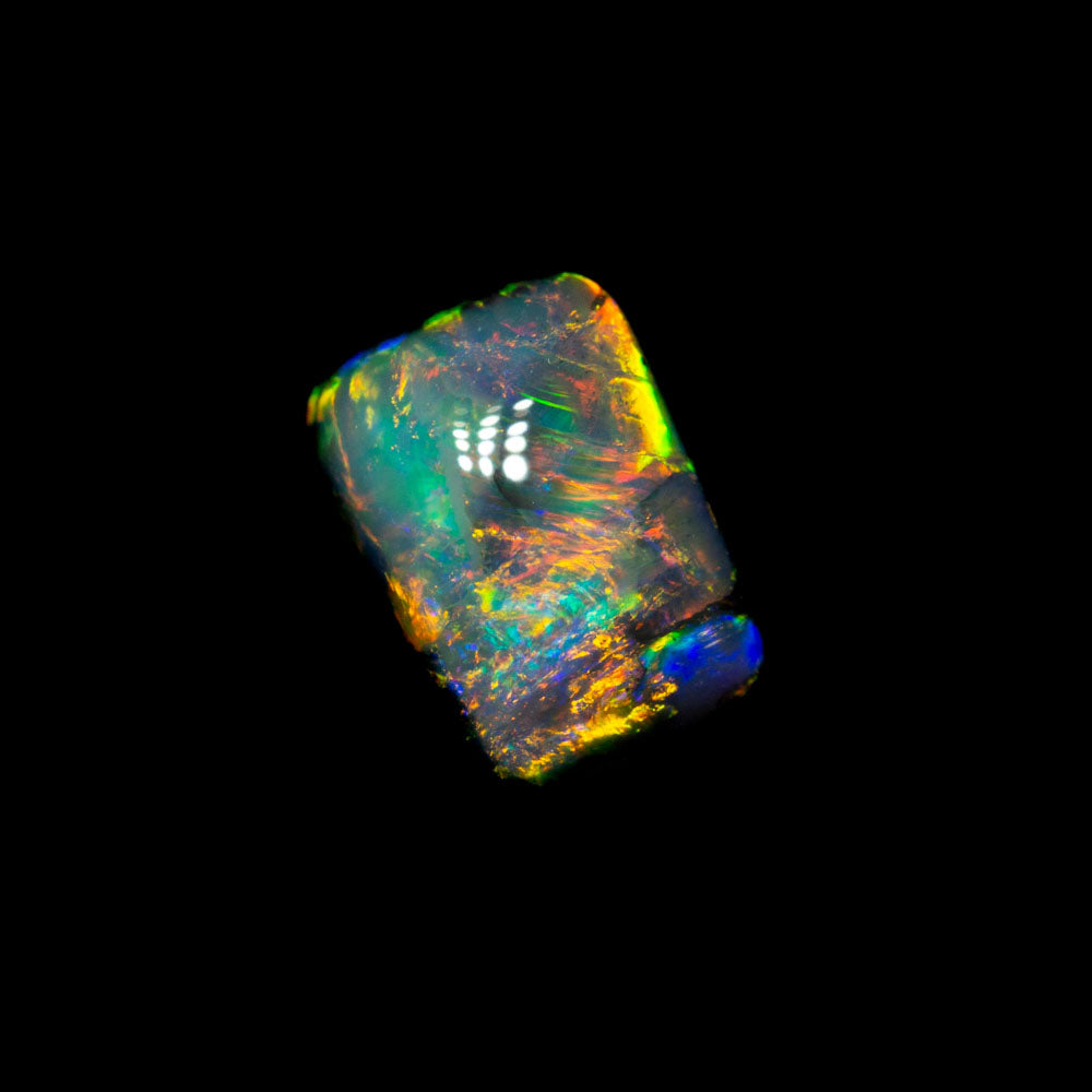 0.94 ct dark opal 6.8x4.8x3.7mm