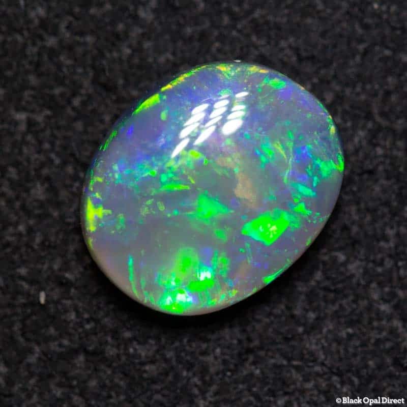 0.94 ct semi black opal 7x6x3mm