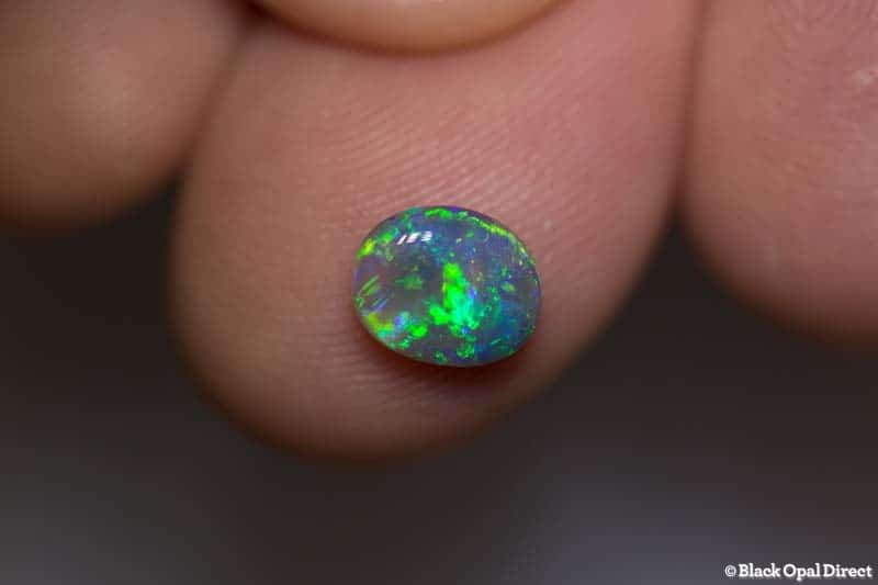 0.94 ct semi black opal 7x6x3mm