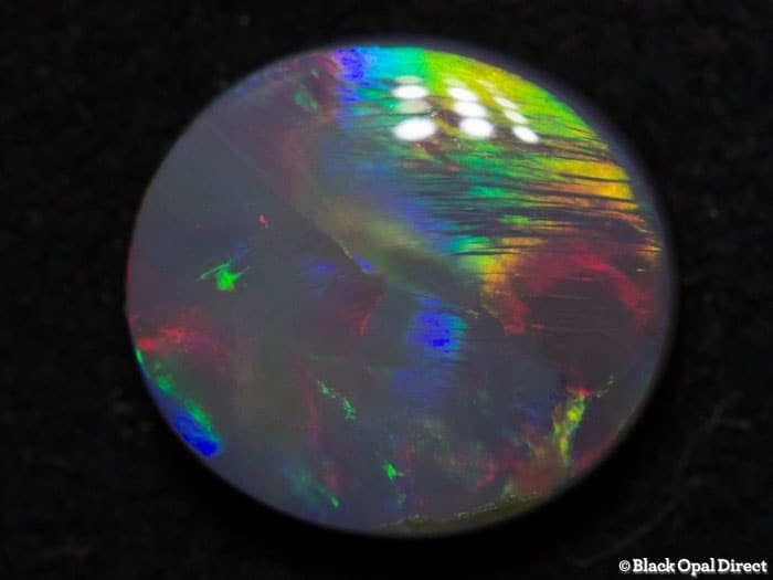 0.95 ct semi black opal 7.5x7x3mm
