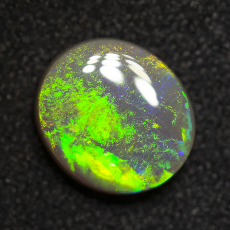 0.96 ct dark opal 7.3x6.5x2.8mm