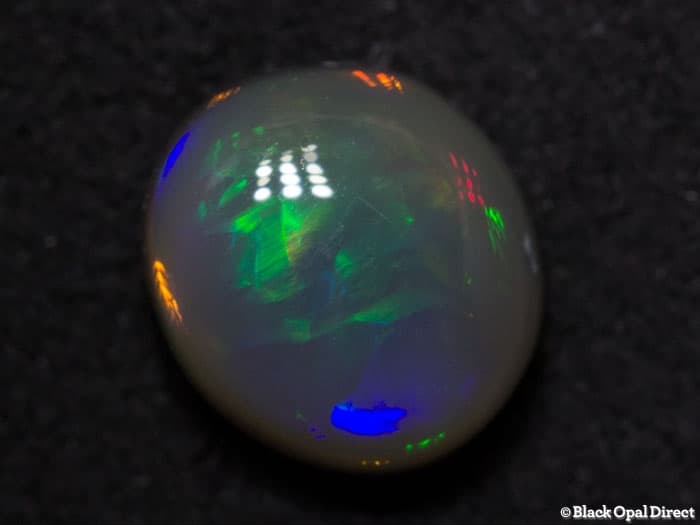0.98 ct semi black opal 7x6x4mm