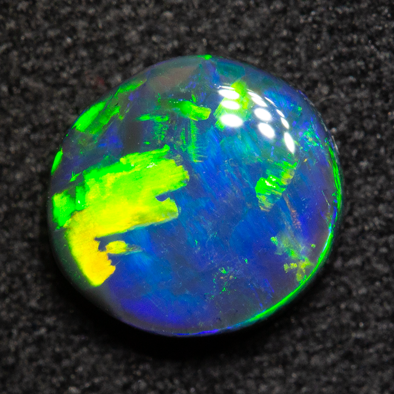 0.99 ct black opal 7.1x6.7x3mm