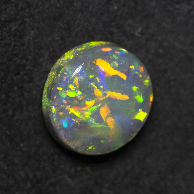 0.99 ct black opal 6.9x6.4x3.6mm