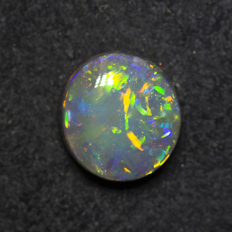 0.99 ct black opal 6.9x6.4x3.6mm