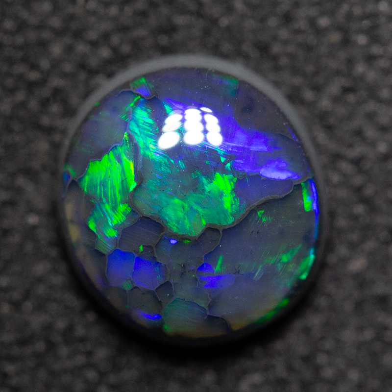 0.99 ct black opal 7.1x6.6x3.3mm