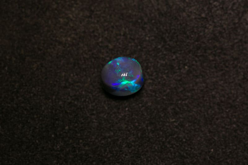 1.00 ct black opal 6.5x5x4.5mm