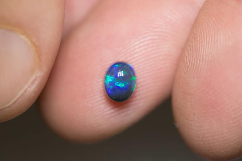 1.00 ct black opal 6.5x5x4.5mm