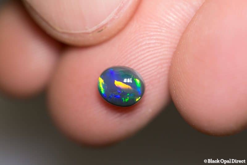 1.05 ct black opal 7x6x3.5mm