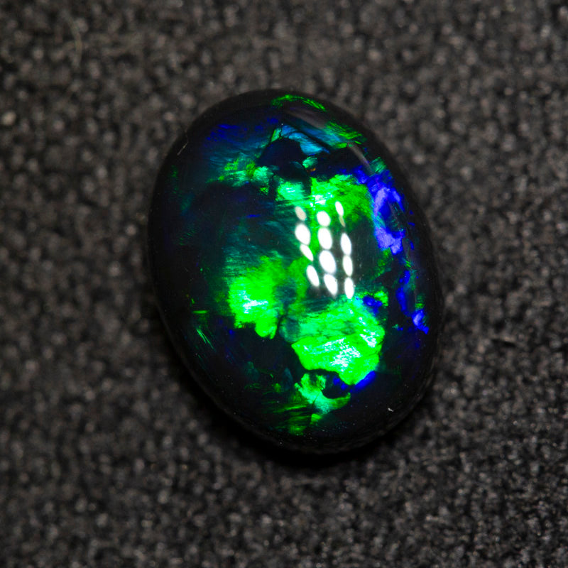1.06 ct black opal 7.7x5.9x3.8mm