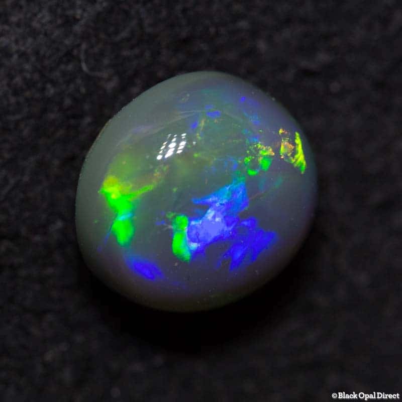 1.06 ct black opal 6mm round x4mm