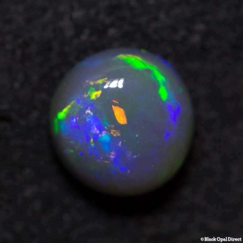 1.06 ct black opal 6mm round x4mm