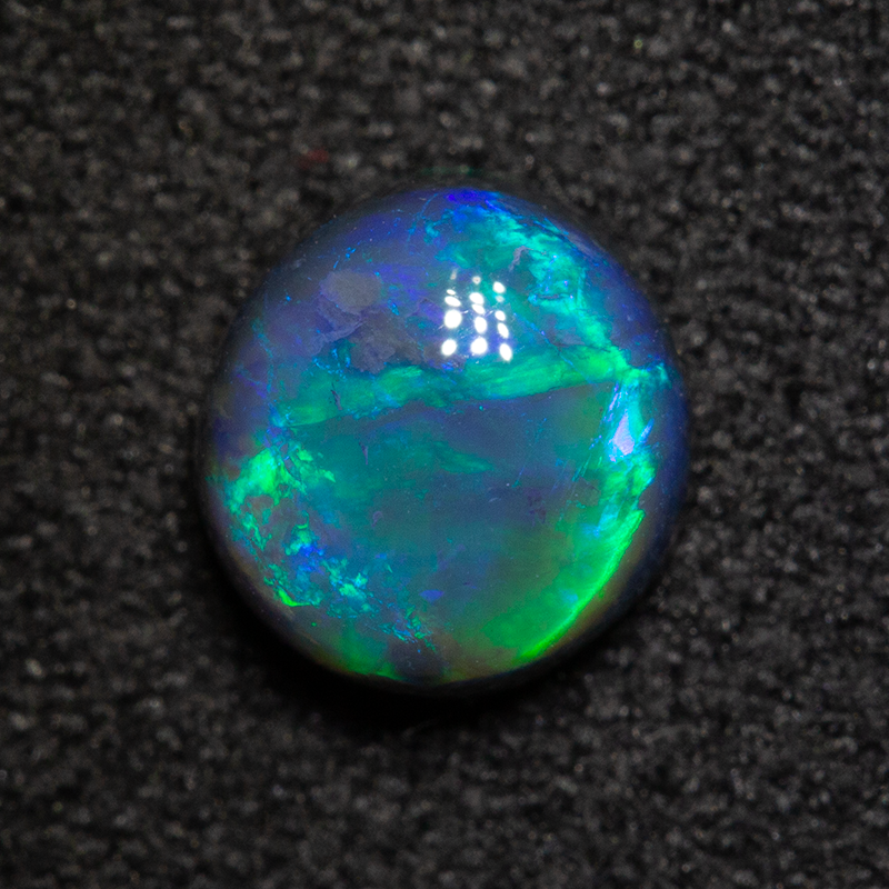 1.08 ct black opal 6.6x6.3x3.9mm