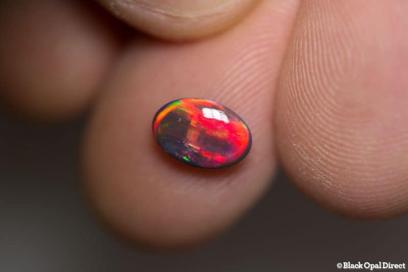 1.19 ct red on black opal gem 9x6x3mm