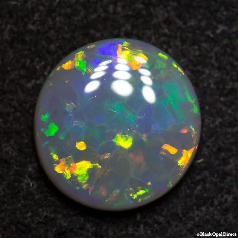 1.22 ct dark opal 8.5mm round x 2.5 thick