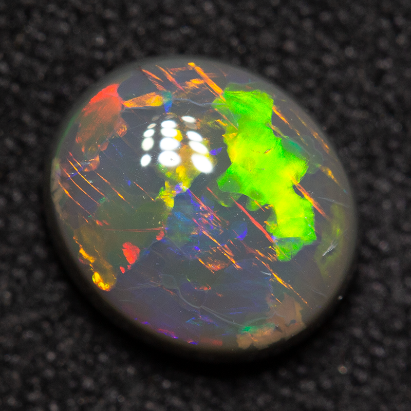 1.26 ct black opal 7.7x6.8x3.6mm