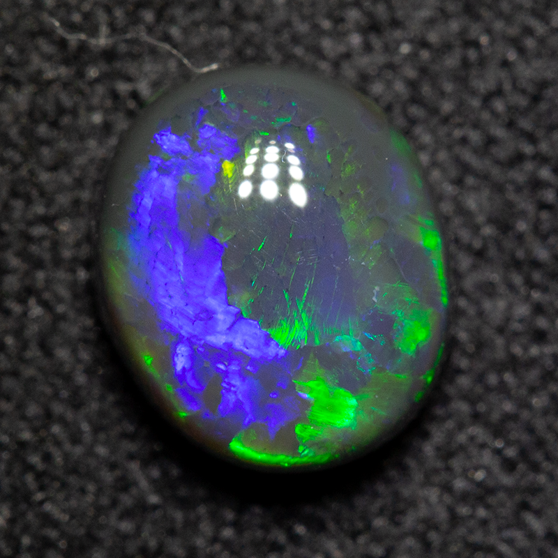 1.30 ct black opal 7.5x6.5x4mm