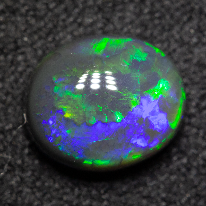 1.30 ct black opal 7.5x6.5x4mm