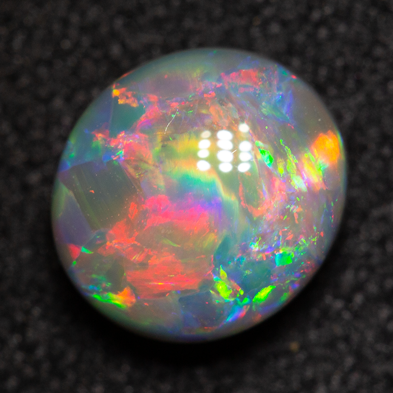 1.31 ct black opal 7.5x6.8x4.2mm